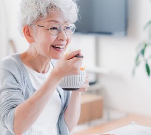 Woman enjoying a bowl of yogurt