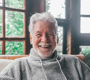 Man smiling in comfortable cabin atmosphere 