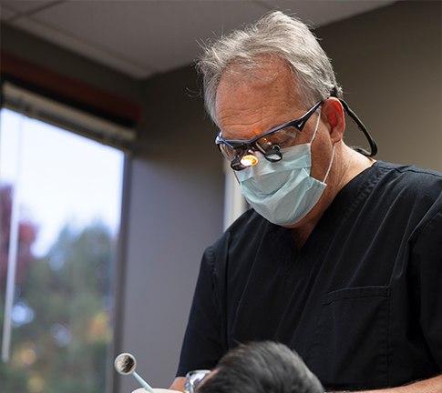 Dentist examining dental patient