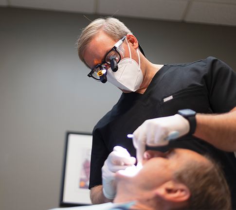 Dentist treating dental patient