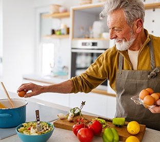 Dentures patient in Raleigh eating healthy