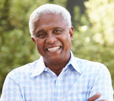 Man with dentures smiling