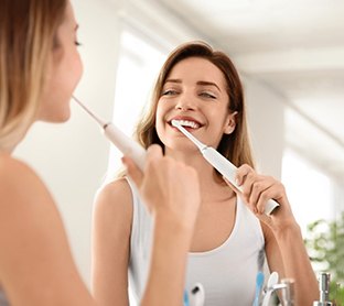 Woman brushing her teeth