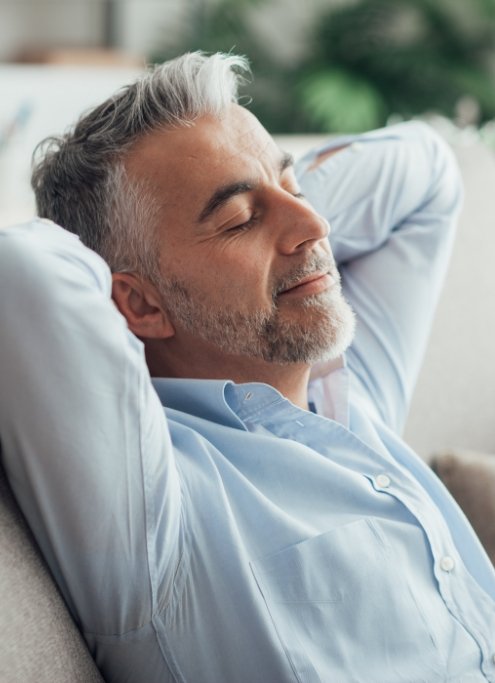 Man relaxing after sedation dentistry visit