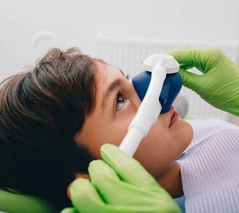 Patient receiving nitrous oxide dental sedation treatment