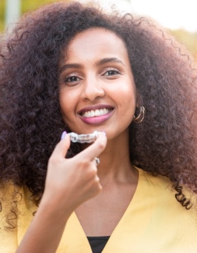 Woman smiling after sedation dentistry visit