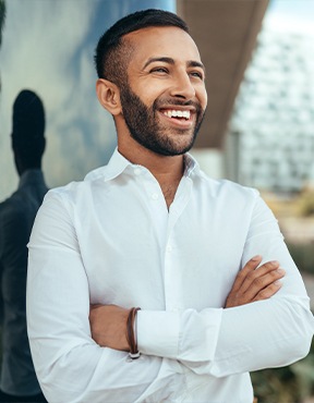 Man smiling after emergency dentistry