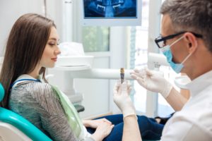 Dentist discussing dental implants with patient